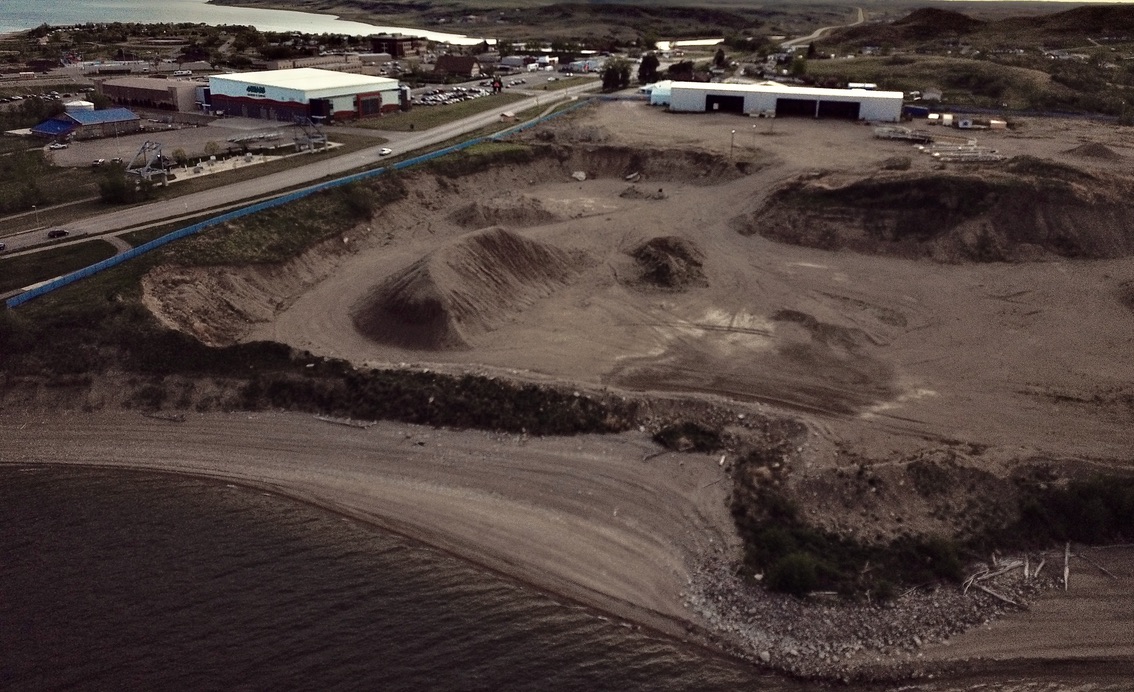 A massivie hole in the ground is what remains of Lakeview Aggregates, once the joint venture between Bird Industries and the Three Affiliated Tribes Four Bears Segement, which was doing business as the Four Bears Economic Development Corporation. PHOTO CREDIT/James Brugh