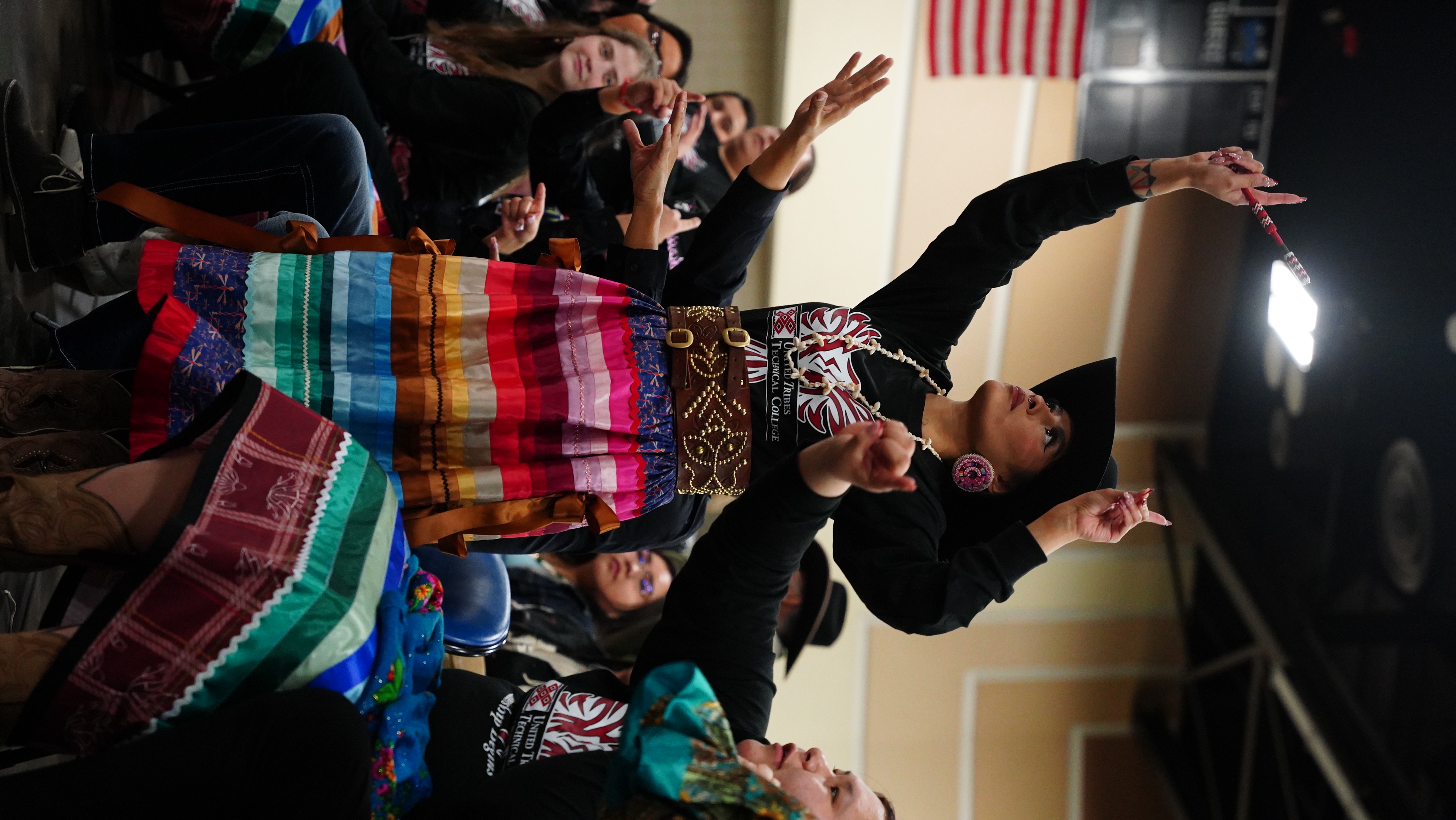 UTTC team captain Zariah Whiteplume dances in AIHEC’s annual hand game tournament, Bismarck, North Dakota.