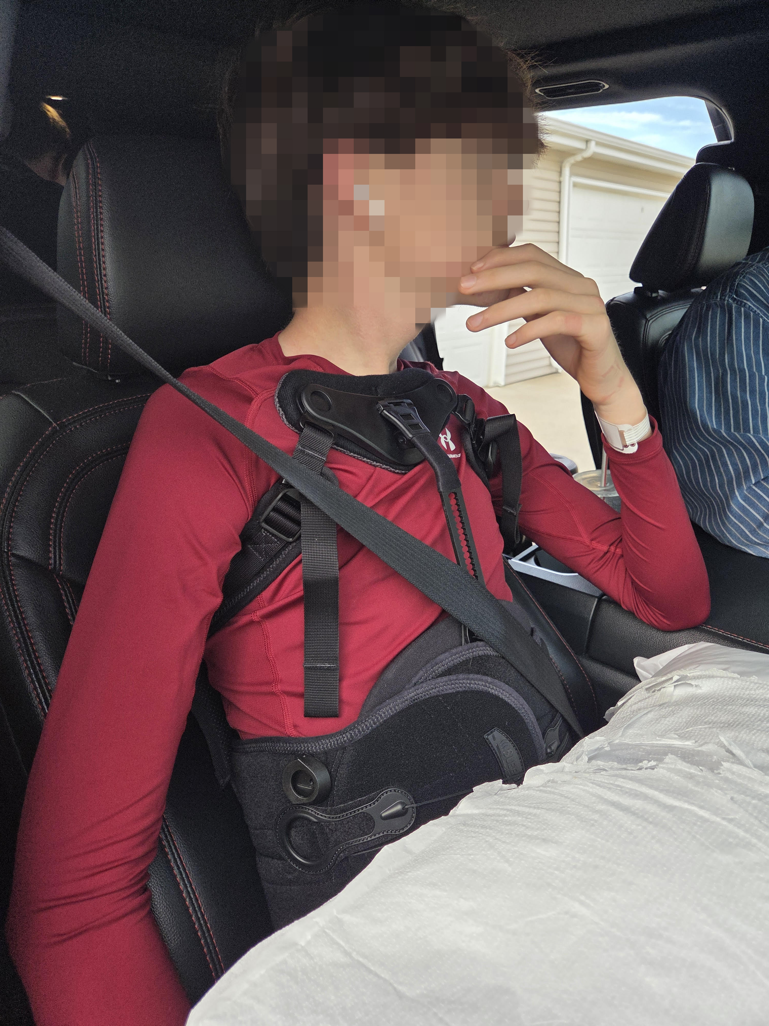 Brigitte Silk’s son was discharged from Sanford Medical Center in Fargo, North Dakota, wearing a back brace, Saturday, Oct. 11, 2025. His face has been blurred to protect his identity.