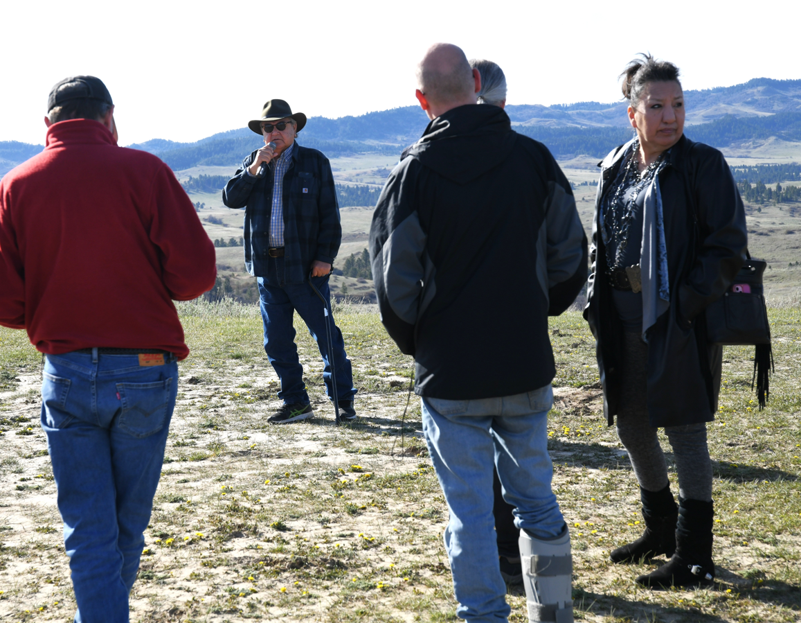 Marvin Dawes (standing in hat and sunglasses, second from left), a Crow tribal member and former ranger at the Little Bighorn Battlefield National Monument, telling a group about the Crow's Nest in the Wolf Mountains behind him on April 11, 2026. It’s where Crow and Arikara scouts first spotted the large Sioux and Cheyenne camp 15 miles to the west in the valley of the Little Big Horn.