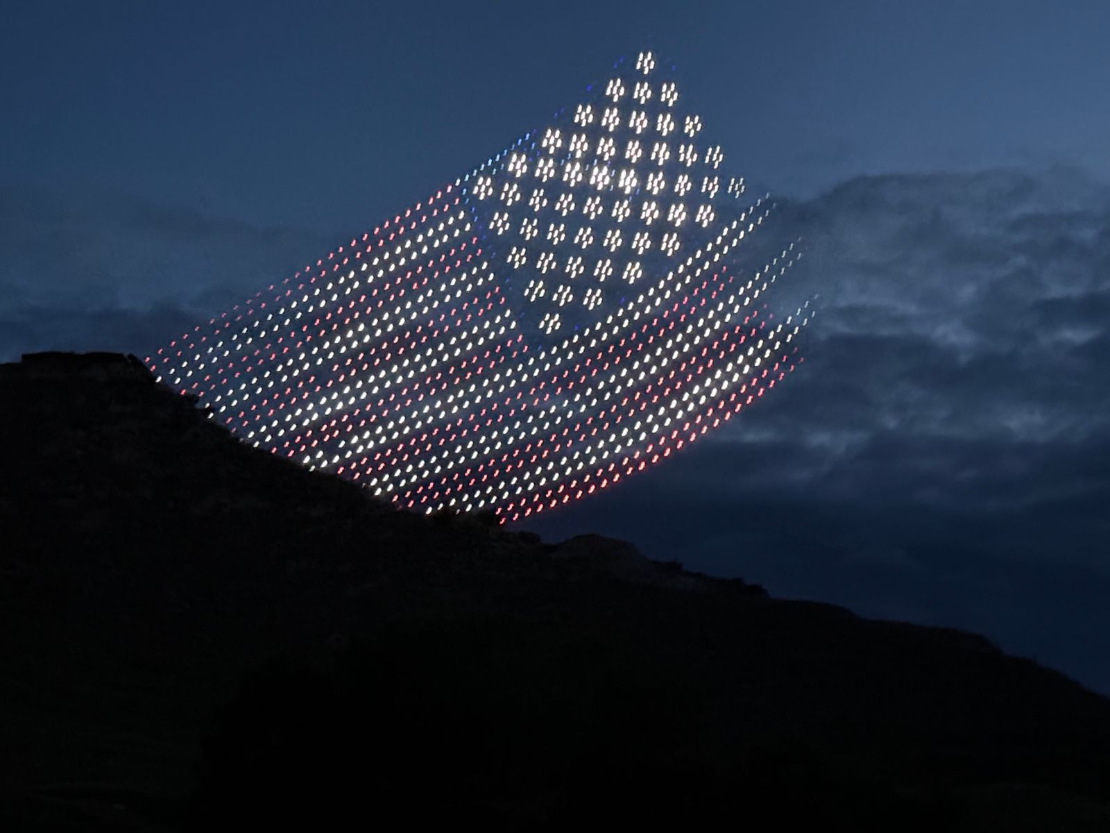 A drone show lights up the sky, previewing the opening celebration of the Theodore Roosevelt Presidential Library, Medora, North Dakota