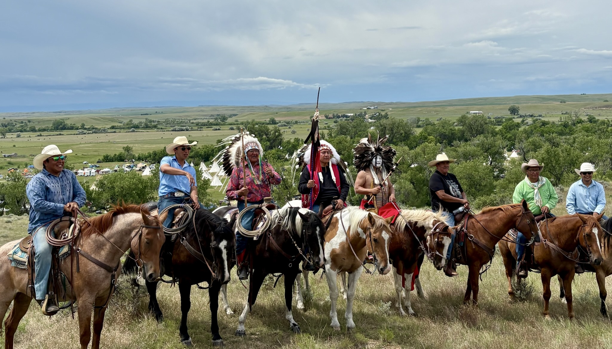 Organizers and relatives of the 150th Greasy Grass commemoration ride to the top of the ridge overlooking the Allied Tribal Nations tipi encampment. Left to right, Cotton Real Bird, Goldman Real Bird, Jim Real Bird, Frank Star Comes Out, Dion Killsback, Ernest Littlemouth, Curtis Real Bird and Milo Paz.