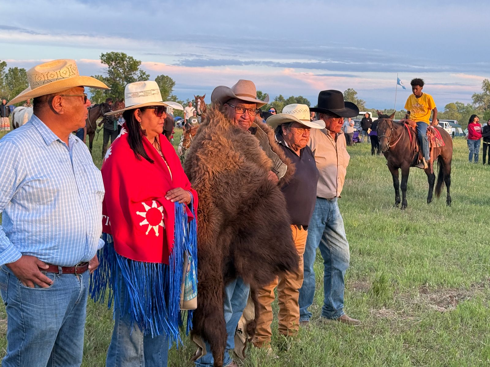 The Oglala Sioux Tribe gifted a painted buffalo robe to the Real Bird family on June 24 at the Allied Tribal Nations tipi encampment near Garryowen, Montana. The family, left to right, Shawn Real Bird, Lucy Real Bird, Curtis Real Bird, Kennard Real Bird and Jim Real Bird welcomed all nation. The main camp was on Curtis Real Bird's land.
