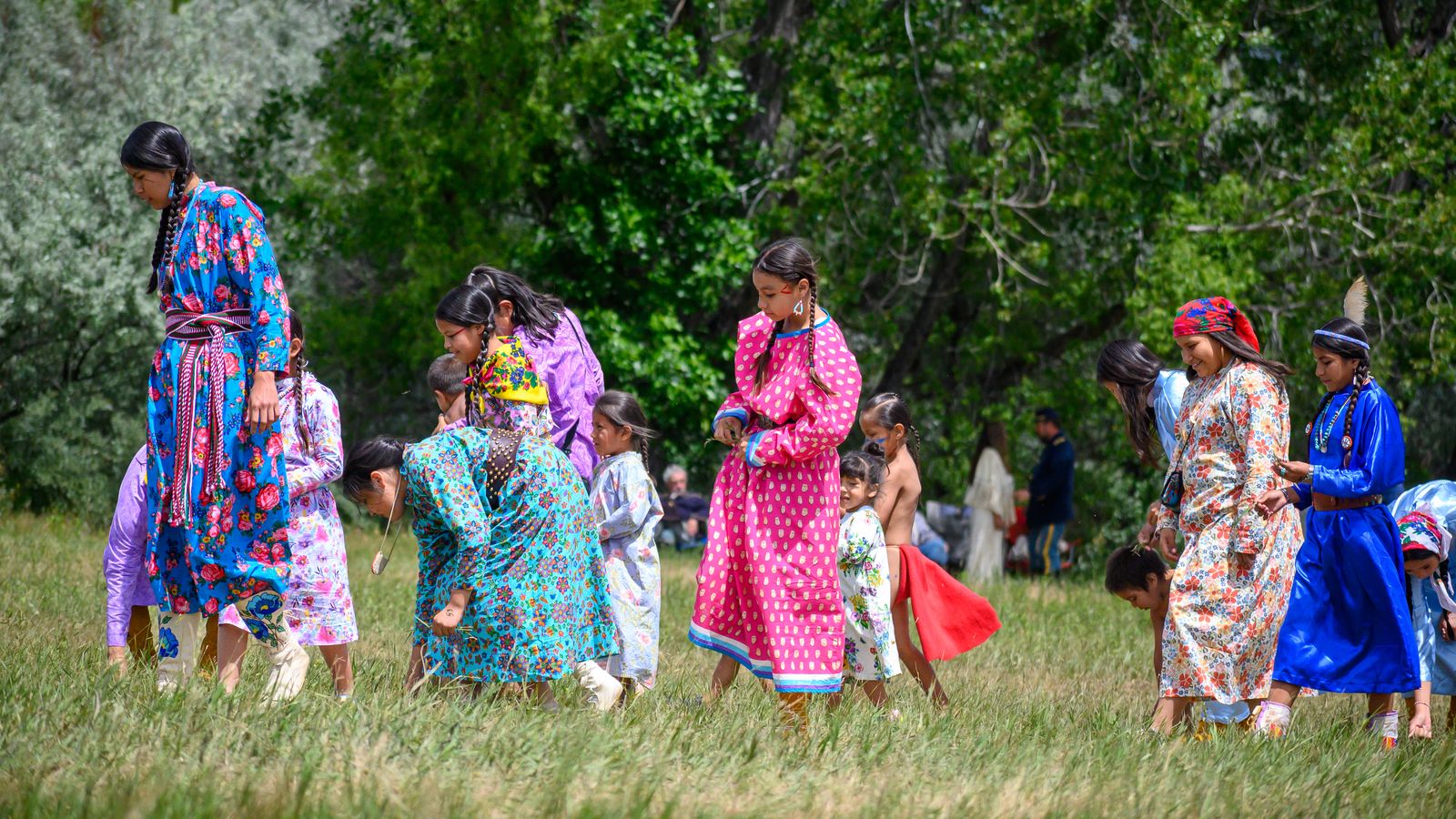 As part of the Real Bird Reenactment, women walk the prairie to dig turnips as a symbolic reference to a way of life they valued.