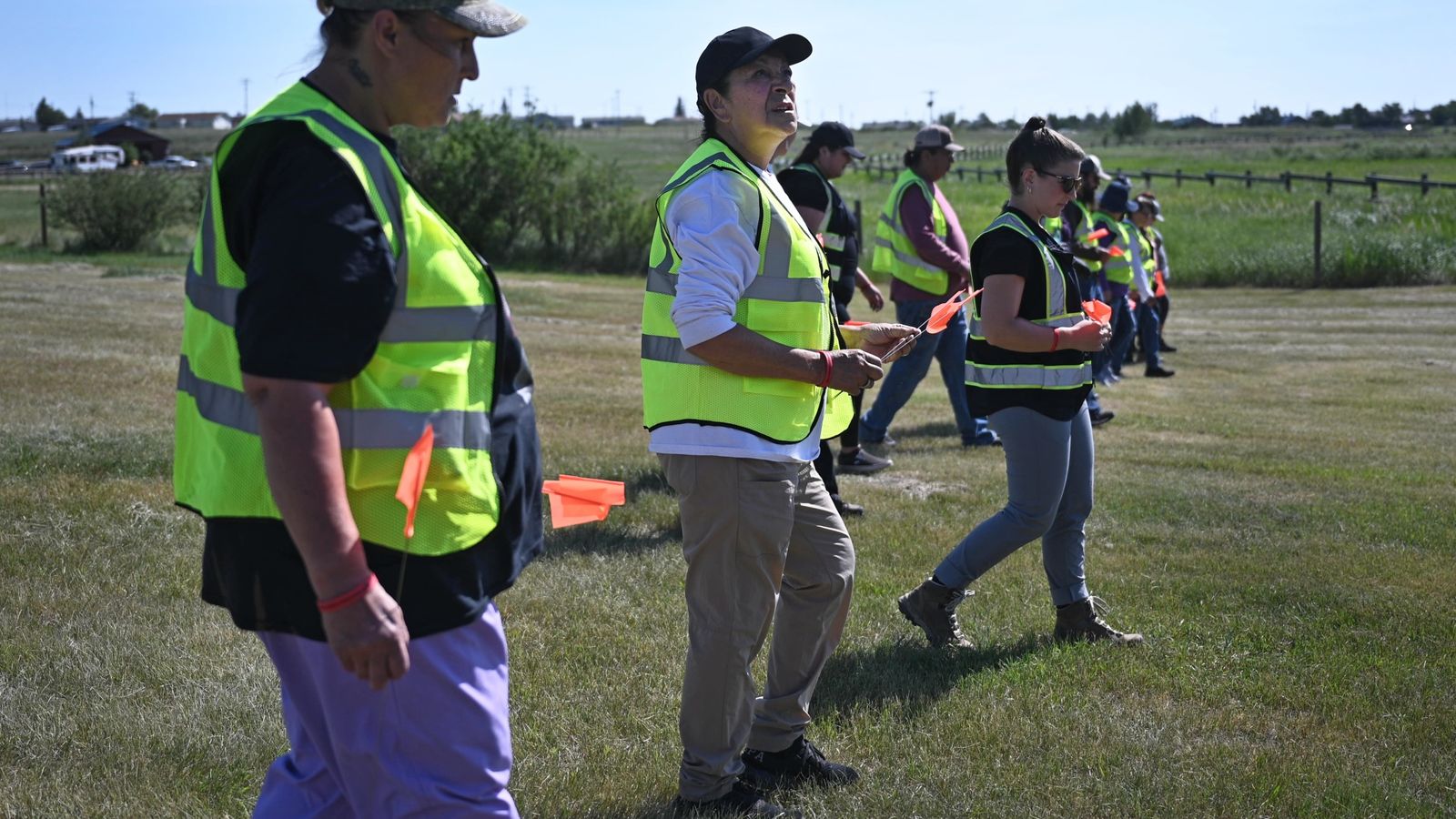 Deana LaMere and Wilma Fleury learn how to properly do a line search during a Ohkomi Forensics training led by Haley Omeasoo July 19, 2026, at the Sleeping Wolf Campground in Browning.