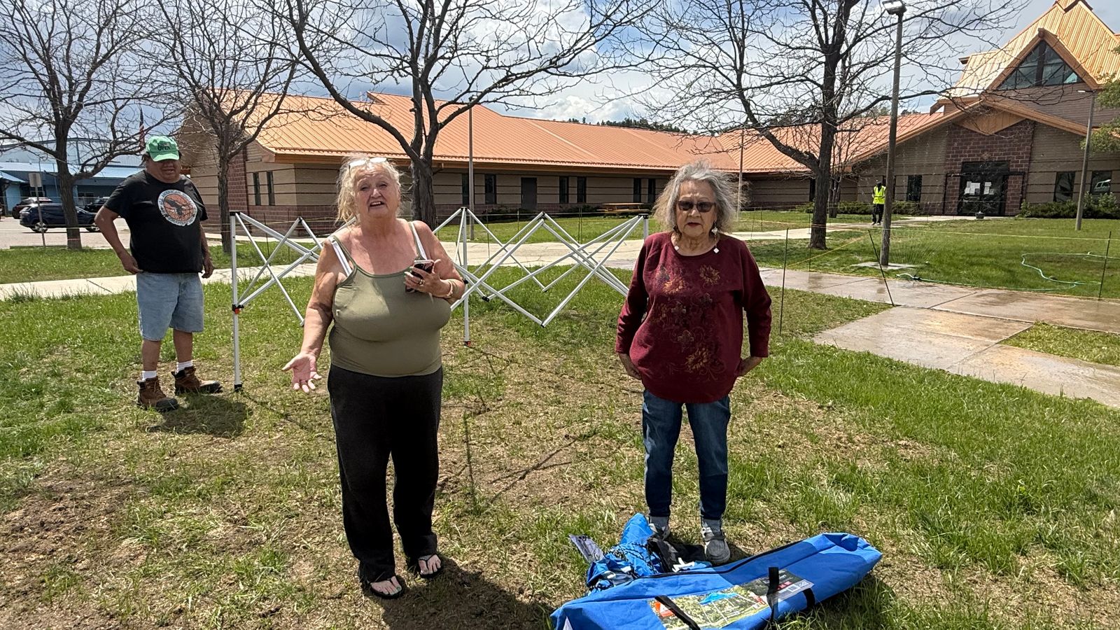 Terri Lonebear and Diane McLean tried to set up a protest shade in front of the Little Wolf Capitol Building. Security guards told they had to move, May 20, 2026.