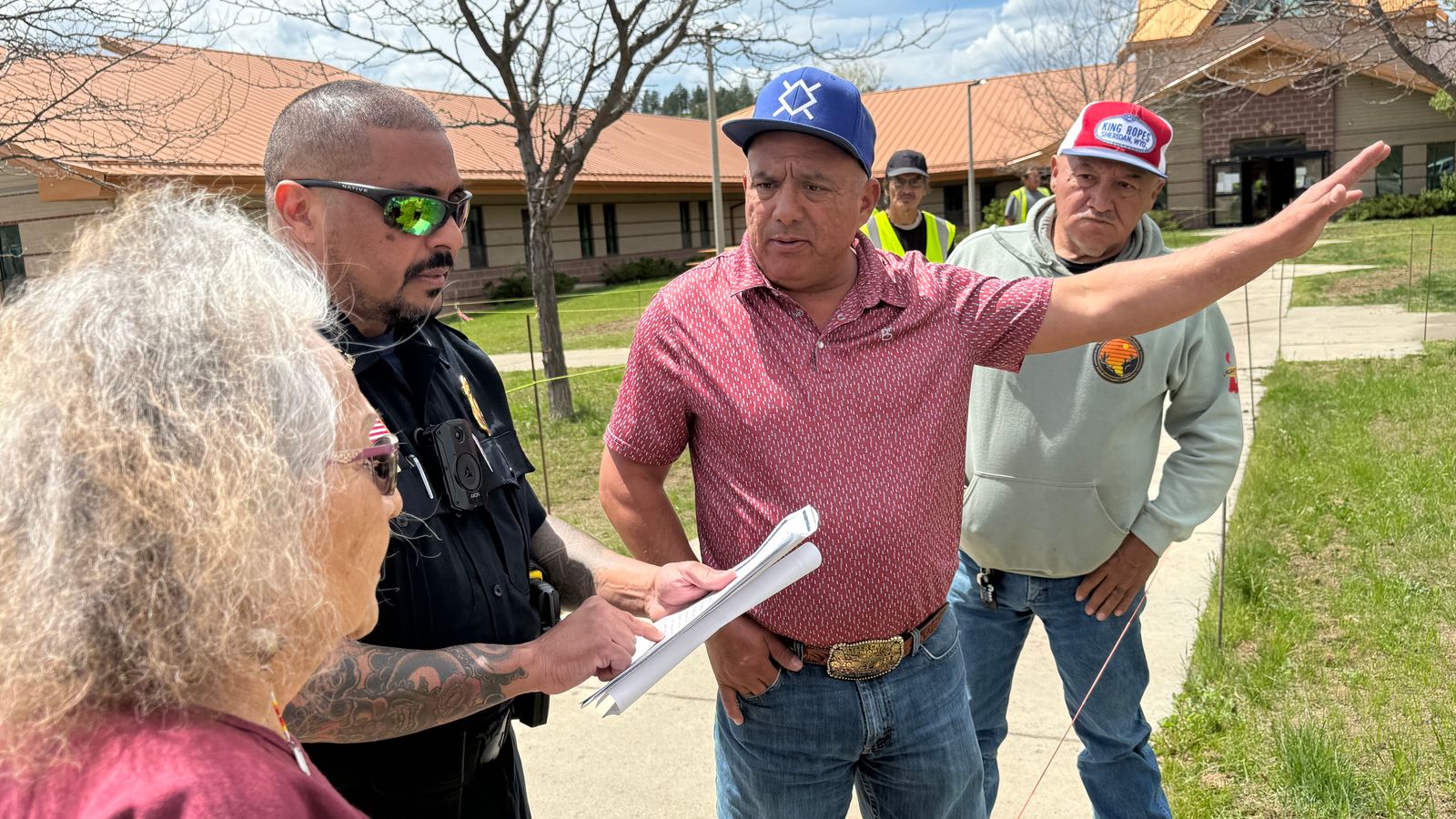 Northern Cheyenne President Gene Small talks to Diane McLean about why she and fellow protesters were not allowed to set up a shade on the grass in front of the tribe’s capitol building, May 20, 2026.