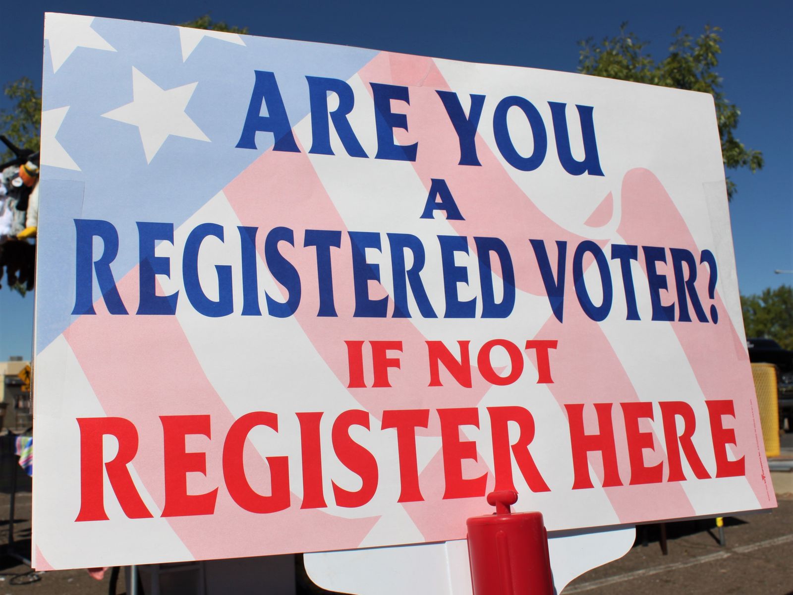 A sign advertises voter registration in Las Cruces, New Mexico.