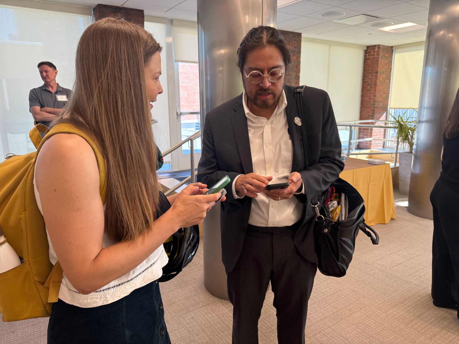 Shaun Griswold talks with Canadian photojournalist Amber Bracken during a democracy symposium on voting rights and press freedom, Harvard Kennedy School, Friday, Sept. 11, 2026. The event marks Griswold’s first week reporting for Buffalo’s Fire.