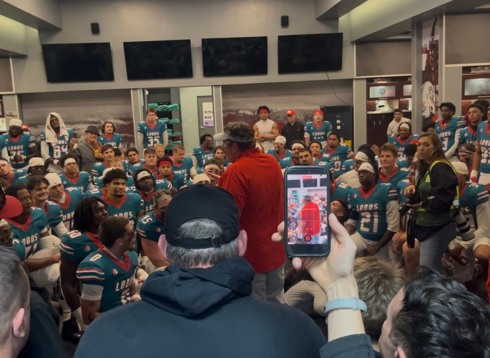 New Mexico football head coach Jason Eck shares a postgame speech with his team after a 21-16 win over North Dakota State.