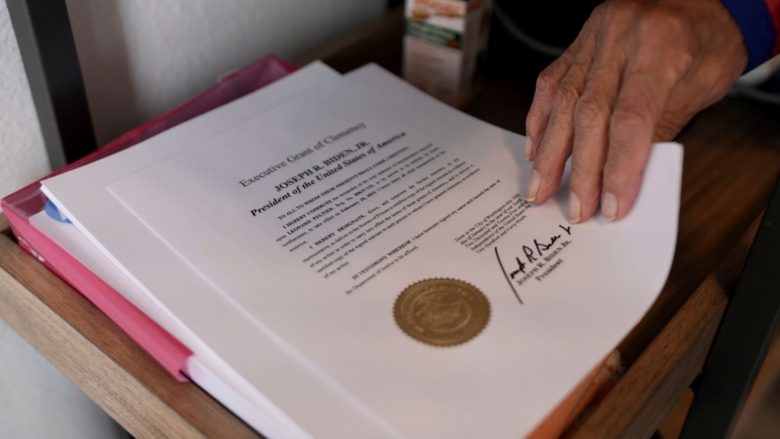 Leonard Peltier holds a copy of his commutation in Belcourt, N.D.