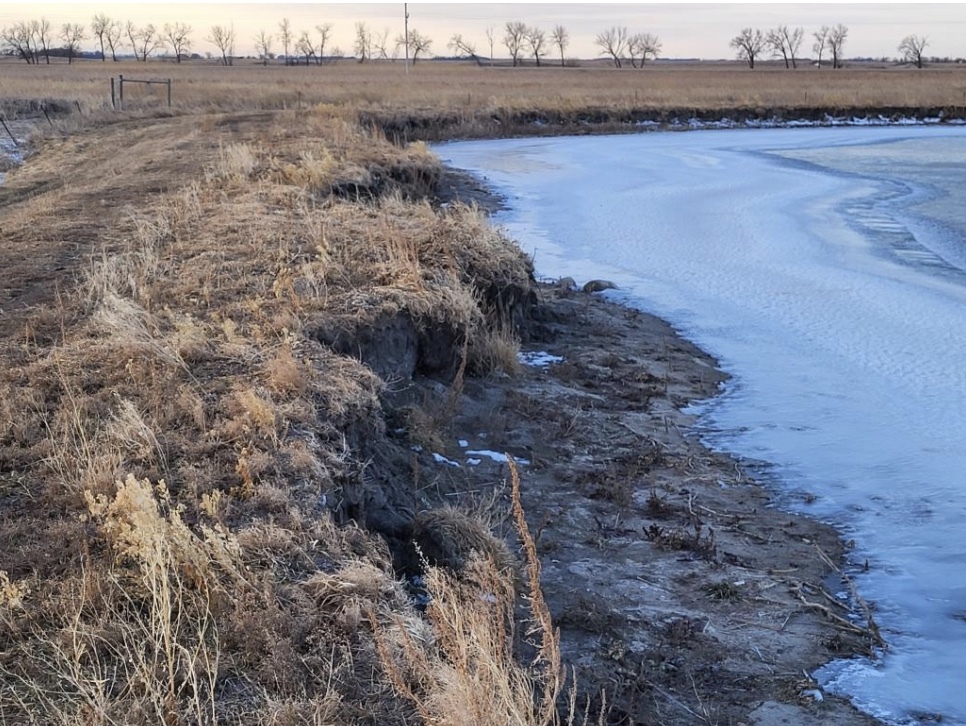 The banks of a 102-year-old wastewater lagoon in Fessenden, N.D., show erosion. Plans to dredge, stabilize and wrap the banks were put on indefinite hold after the Trump administration revoked millions of dollars in federal funding for disaster mitigation infrastructure projects. (Photo credit: Wells County Emergency Management)