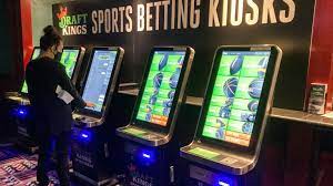Zach Young, of New Haven, Conn., places a bet at one of the new sports wagering kiosks at Foxwoods Resort Casino in Mashantucket, Conn., Thursday, Sept. 30, 2021. Young says he's been "waiting for this day," recalling how he'd often scroll through sports betting apps he couldn't play in preparation. The unveiling of temporary sports betting venues at the state's two tribal casinos, Foxwoods and Mohegan Sun, mark the first step in the rollout of Connecticut's new law legalizing sports and online wagering. (AP Photo/Susan Haigh)