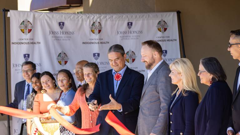 Donald Warne, co-director for the Center for Indigenous Research, cuts the ribbon on the new Great Plains Hub at the Mandalay Plaza in Rapid City. (Photo by Amelia Schafer, ICT/Rapid City Journal)