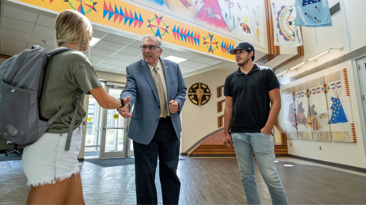 South Dakota State University President Barry Dunn, Rosebud Sioux, confers with two students in the popular SDSU American Indian Student Center, which opened in 2020. (Photo courtesy SDSU)