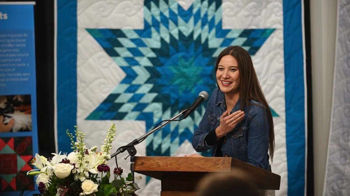 Megan Red Shirt-Shaw speaks at Dominican University in River Forest, Illinois, on Jan. 17, 2023. Two University of South Dakota faculty members, Megan Red Shirt-Shaw and her husband, John Little, have long included their gender pronouns and tribal affiliations in their work email signature blocks. But both received written warnings from the university in March that doing so violated a policy adopted by the South Dakota Board of Regents in December. (Ryan Pagelow/Dominican University via AP)