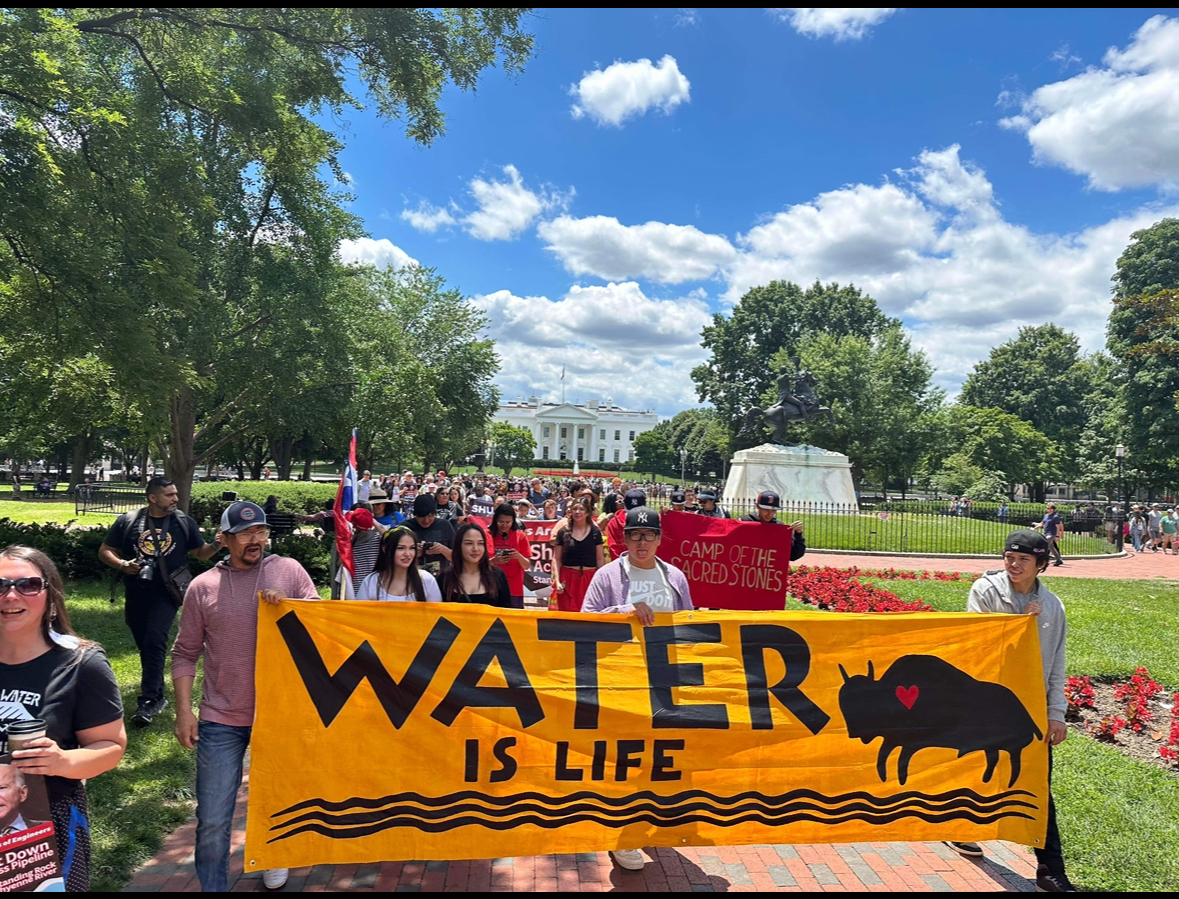 The Defenders of the Water School students protest in front of the White House, advocating for the closure of the Dakota Access Pipeline, which carries oil through the Missouri River just north of the Standing Rock Reservation, Washington, D.C., June 11, 2024. (Mní Wičhóni Nakíčižiŋ Wóuŋspe/Memorie White Mountain)