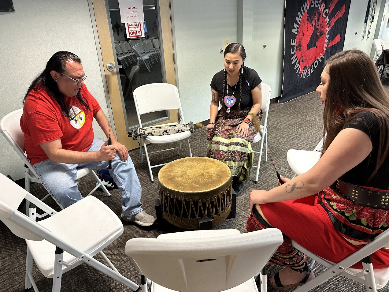 (From L to R:) Josh Piatro, Gloria Martinez and Christina Garcia do an honor song for MMIP’s victims, families and communities, Saturday, May 3, 2025.