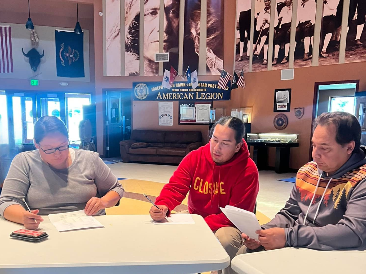 Amber Gwin, Eya Co Nape Fox and Loren White, Jr. learn Sáhniš in a community language class at the Arikara Cultural Center in White Shield, October 2023. (Photo credit: Logan Sutton)