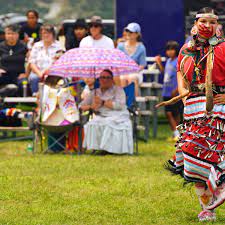 Kaitlyn Miller, 14, Omaha Tribe, dances in a jingle dress at the Missing and Murdered Indigenous Relatives Pow Wow on Saturday, July 15, 2023 in Sioux City, Iowa. Miller was crowned princess at the powwow. (Kevin Abourezk, ICT)