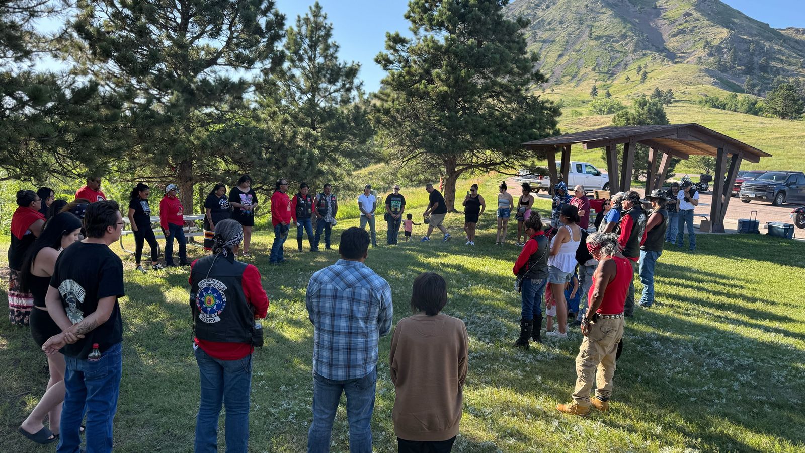 Riders gather in a prayer circle at Bear Butte, South Dakota, to close the “You Are Not Forgotten” Missing Murdered Indigenous Persons benefit ride on July 13. The event honored Cole Brings Plenty and raised awareness of the MMIP crisis. (Photo credit/ Jodi Spotted Bear)