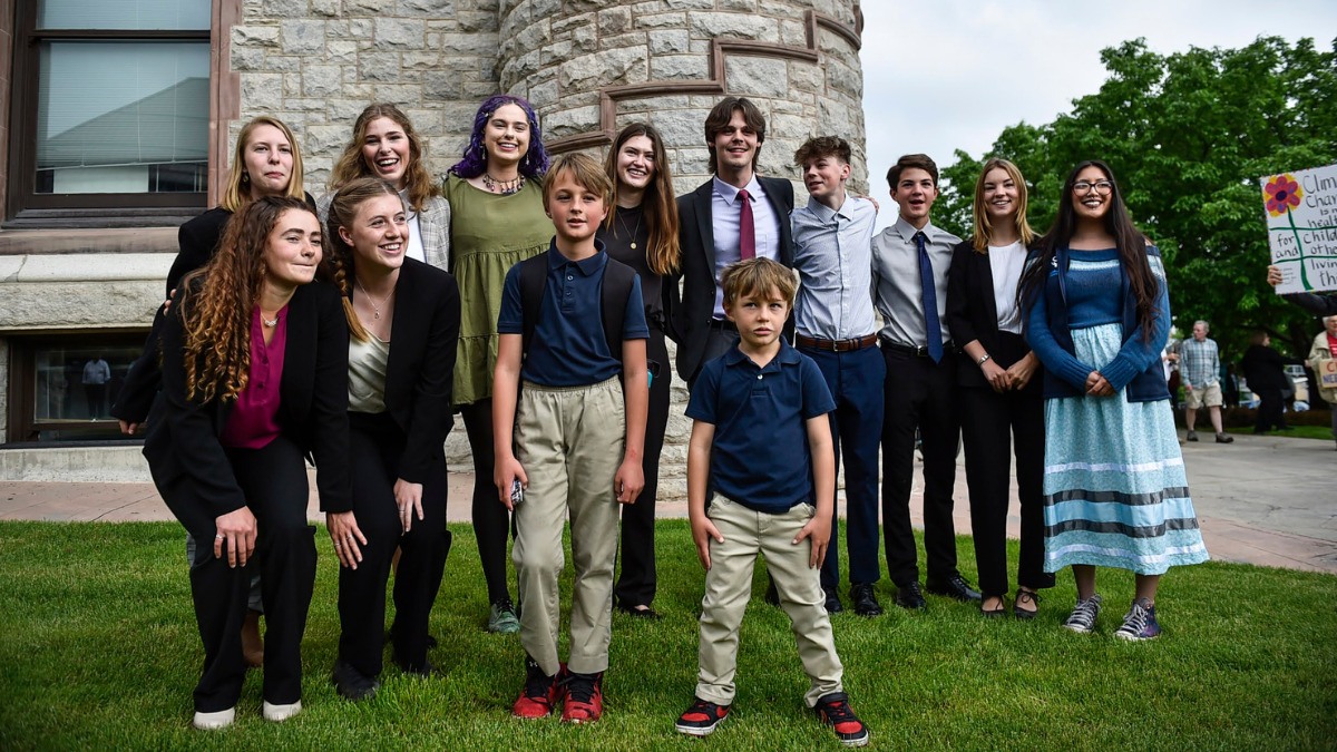 Youth plaintiffs in the climate change lawsuit, Held vs. Montana, pose for a photo outside the Lewis and Clark County Courthouse on June 12, 2023, the first day of hearings in the trial. Credit: Thom Bridge / Independent Record