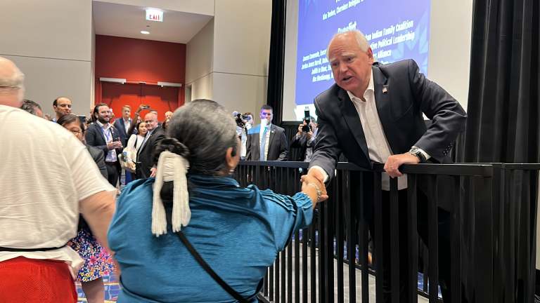 Minnesota Gov. Tim Walz shakes hands with Debbie Nez-Manuel, an elected delegate from Arizona, during the Native American Caucus meeting on Monday August 19, 2024 at the Democratic National Convention. Walz is the vice presidential running mate for Democratic presumptive presidential nominee Kamala Harris. (Photo by Pauly Denetclaw, ICT)