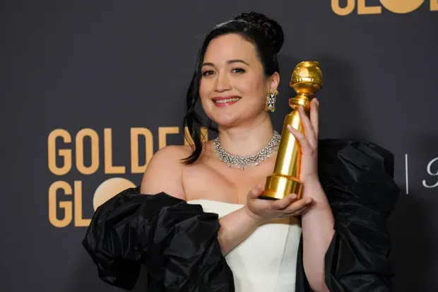 Lily Gladstone poses in the press room with the award for best performance by an actress in a motion picture, drama for "Killers of the Flower Moon" at the 81st Golden Globe Awards on Sunday, Jan. 7, 2024, at the Beverly Hilton in Beverly Hills, Calif. (AP Photo/Chris Pizzello)