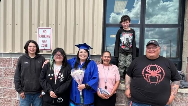 Dale Boushie stands with her family upon graduating from Blackfeet Community College's new BSN program. (Courtesy photo)