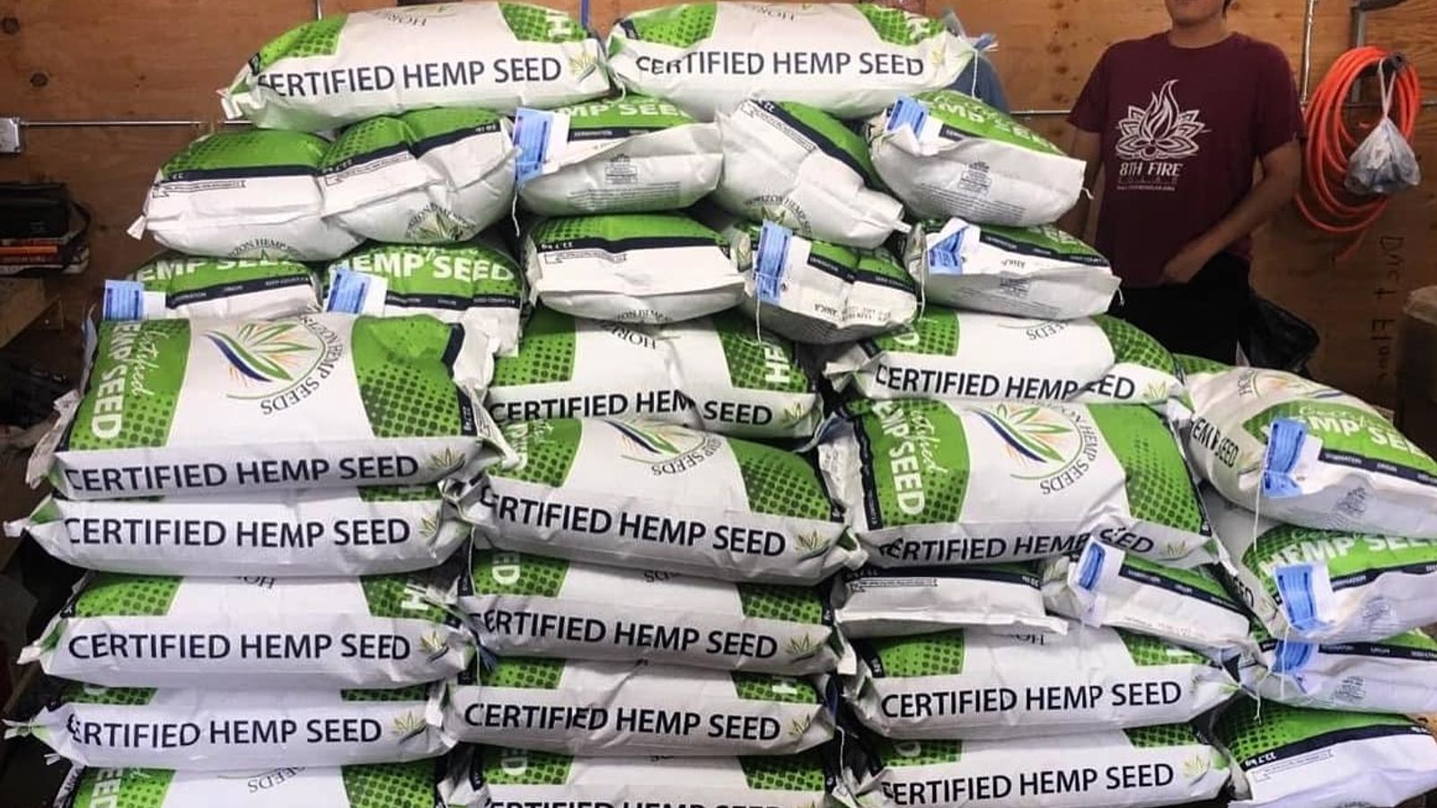Workers at Winona’s Hemp and Heritage Farm pose with seeds for fabric, food, oil, and building material. Photo Courtesy of Winona’s Hemp and Heritage Farm