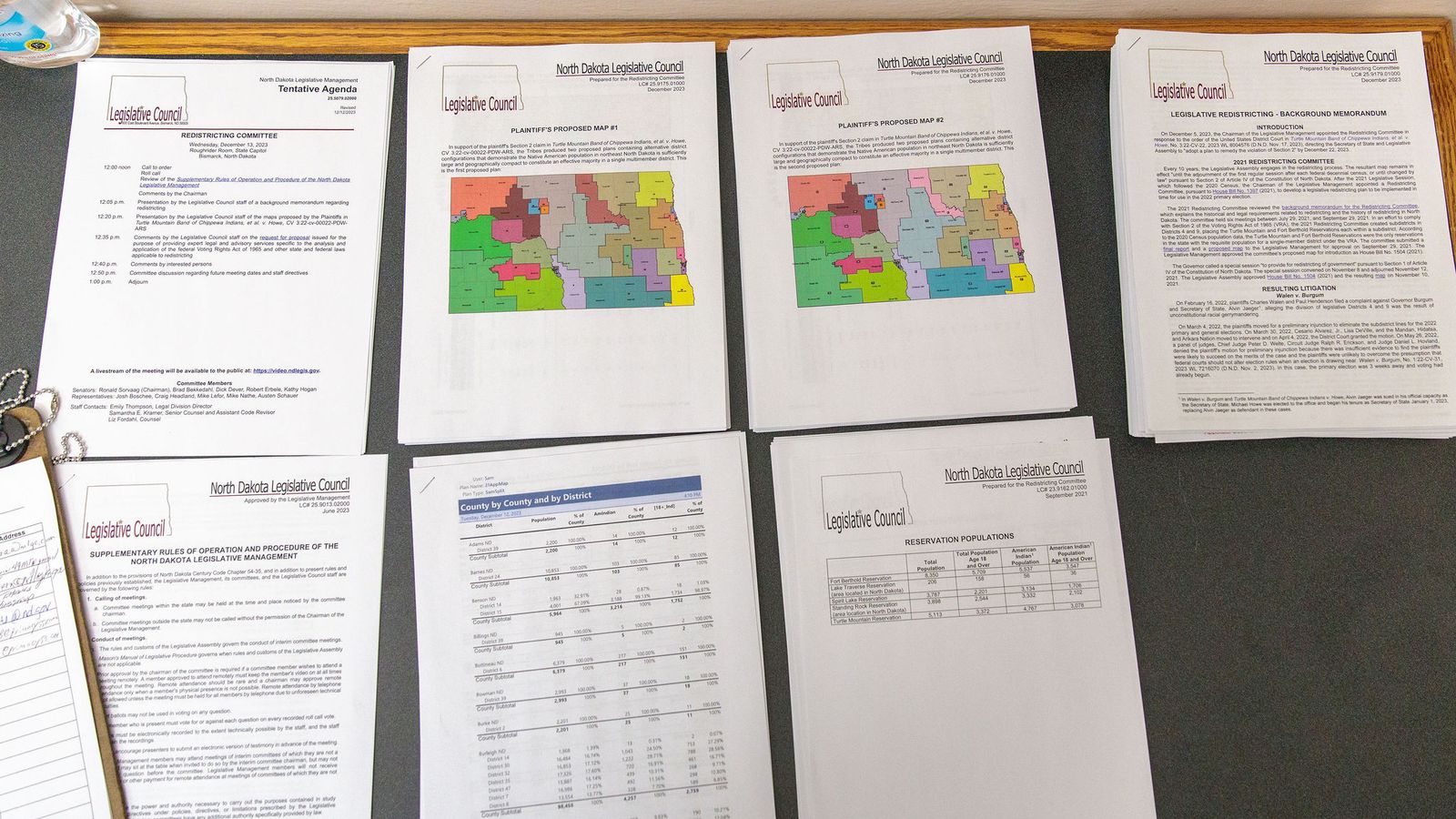 Maps discussed by a North Dakota legislative redistricting committee are displayed at a meeting in December 2023. (Kyle Martin/For the North Dakota Monitor)
