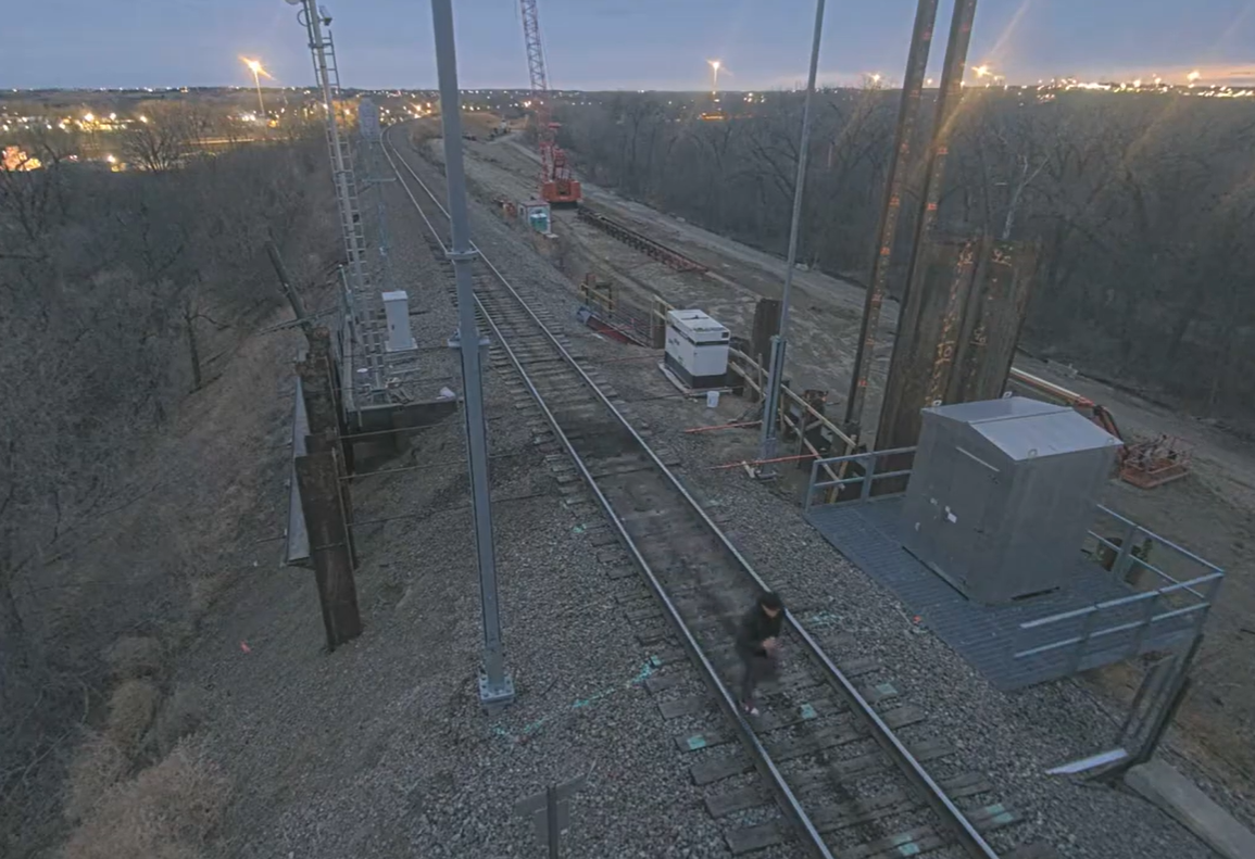 Photos from various surveillance cameras on railroad bridge