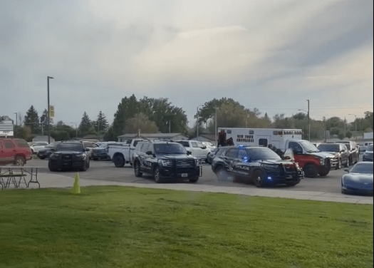 Police cars on the scene at the Mountrail-Williams Electric Cooperative annual meeting in New Town, N.D. after threats of violence were made against American Indians.