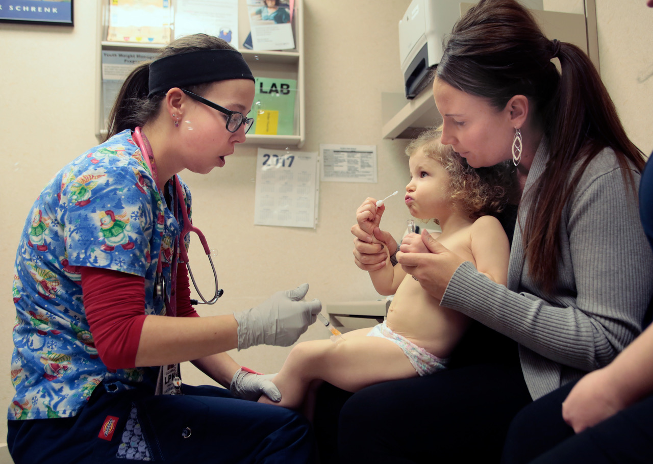 Nurse Julianna Emanuel administers a hepatitis A vaccine shot to Sierra Foss in 2016 at the Sanford Children's Clinic in Fargo. Photo by Dave Wallis, courtesy of The Forum.