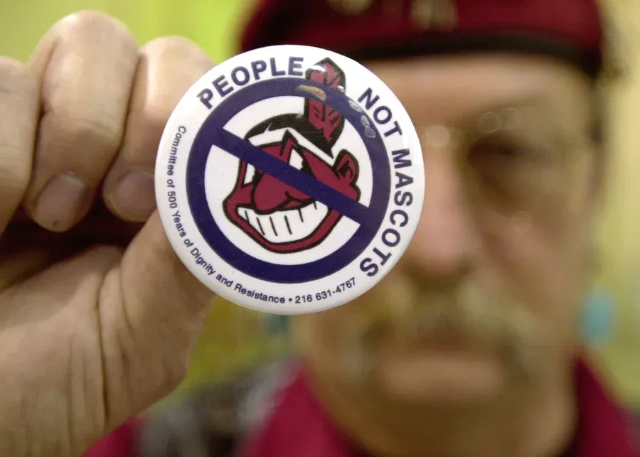Powwow attendee Sonny Hensley holds an anti-mascot button to protest using Indians as mascots for sports teams at the 2003 New Years Eve Sobriety Powwow in Columbus, Ohio.
Mike Simons/Getty Images