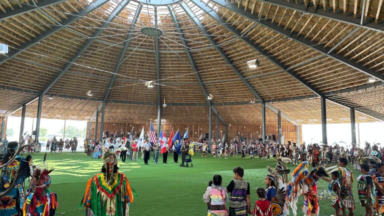 North American Indian Days attendees stand for the color guard during grand entry on Friday, July 7, 2023 in Browning, MT. (JoVonne Wagner, ICT)
