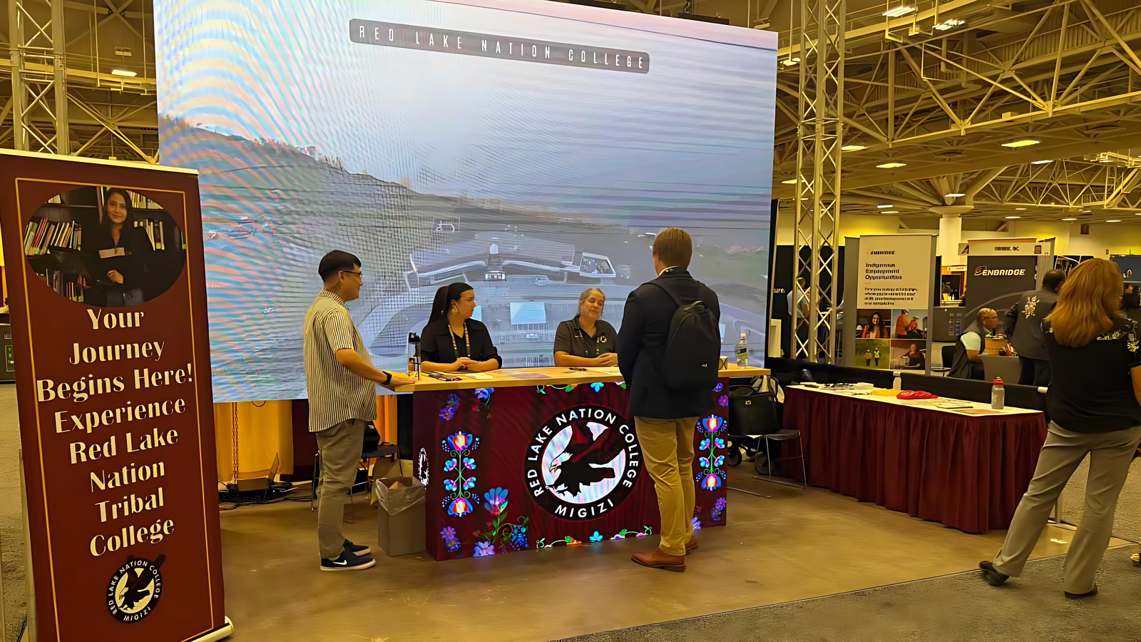 Red Lake Nation College representatives talk with AISES participants during the annual conference held Oct. 2-4 in Minneapolis, Minn. The college provided a tour of its Minneapolis campus, the first urban TCU in the United States. (Buffalo’s Fire/Jodi Rave Spotted Bear)