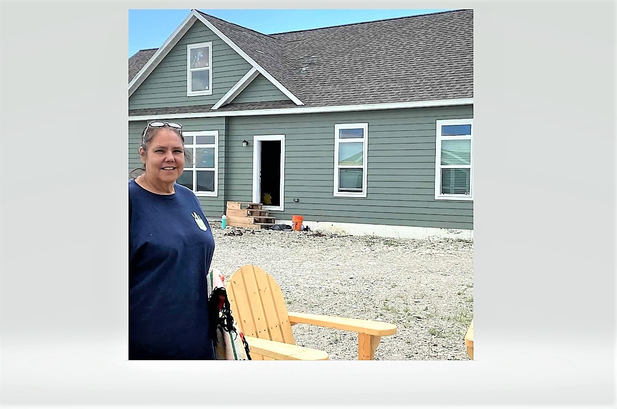 School board member Edith Wagner visits a new modular home, part of the Feather Woman Healing Lodge on Heart Butte School District’s K-12 campus.